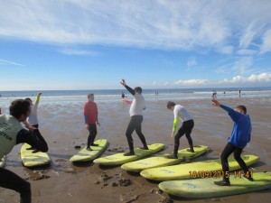 Practicing surfing on dry land.